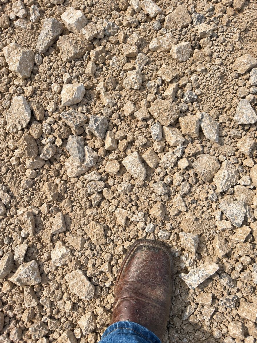 One-and-a-quarter base material with a work boot for scale